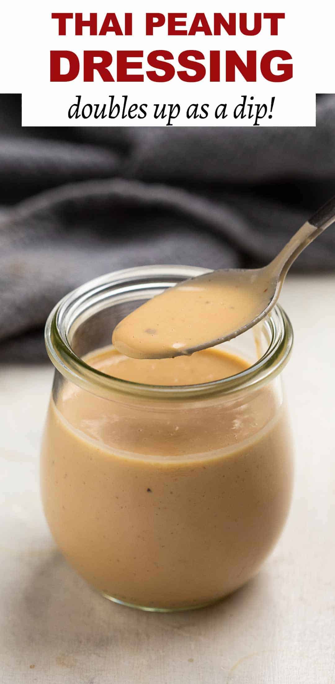 Thai Peanut sauce in a jar with a spoon being taken out