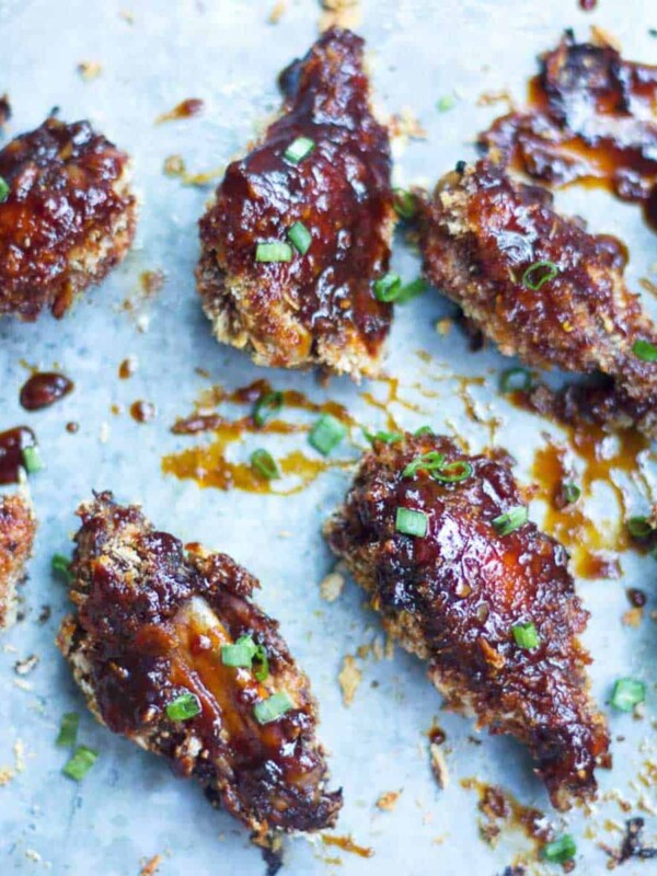 Baked Sticky Chicken Wings lined up on a tray.