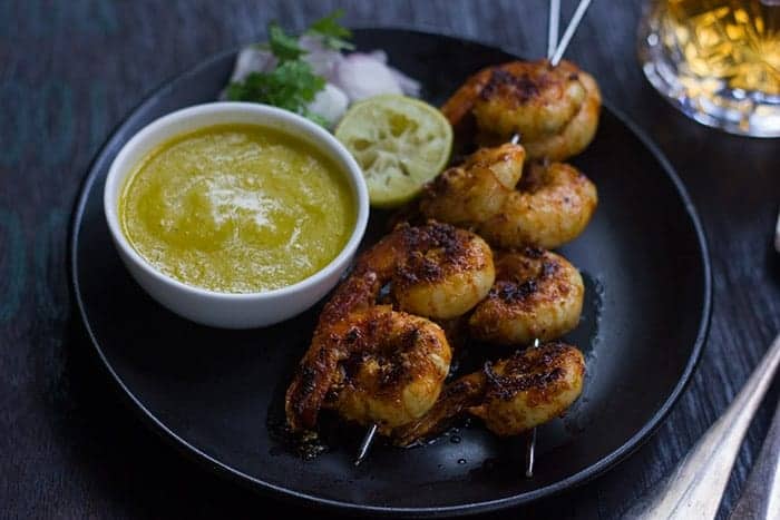 tandoori prawns served with mango chutney, lemon, sliced onions and coriander