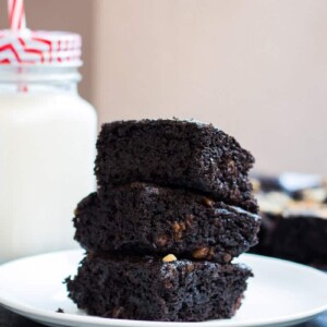 Eggless brownies stacked on top of each other.