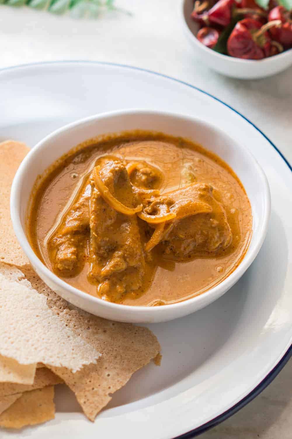 Mangalorean chicken in a white bowl