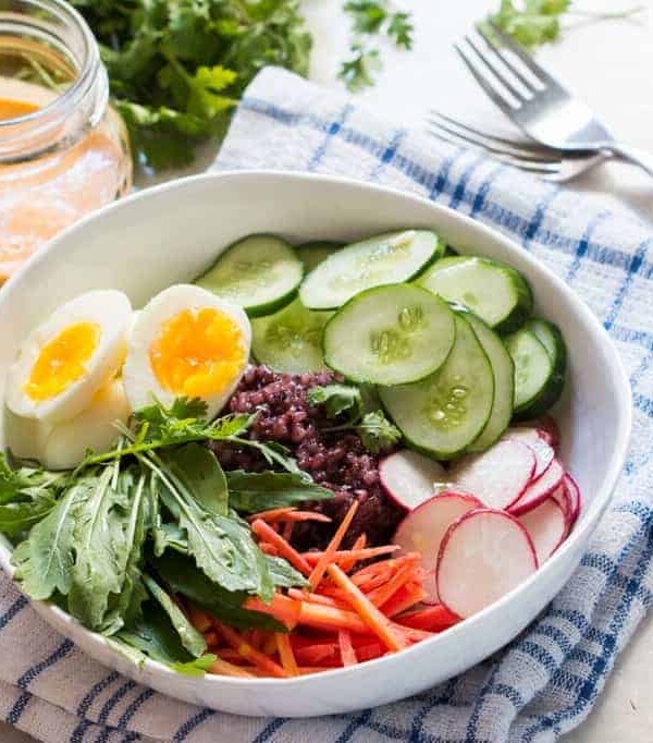 The Black Rice Salad Bowl with Spicy Peanut Dressing served in a white bowl.