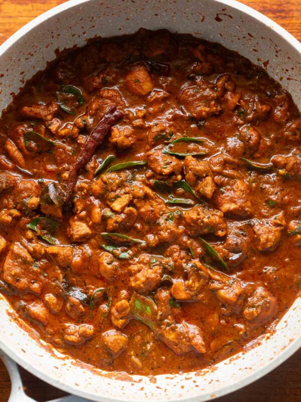 chettinad chicken curry in a white pan ready to be served