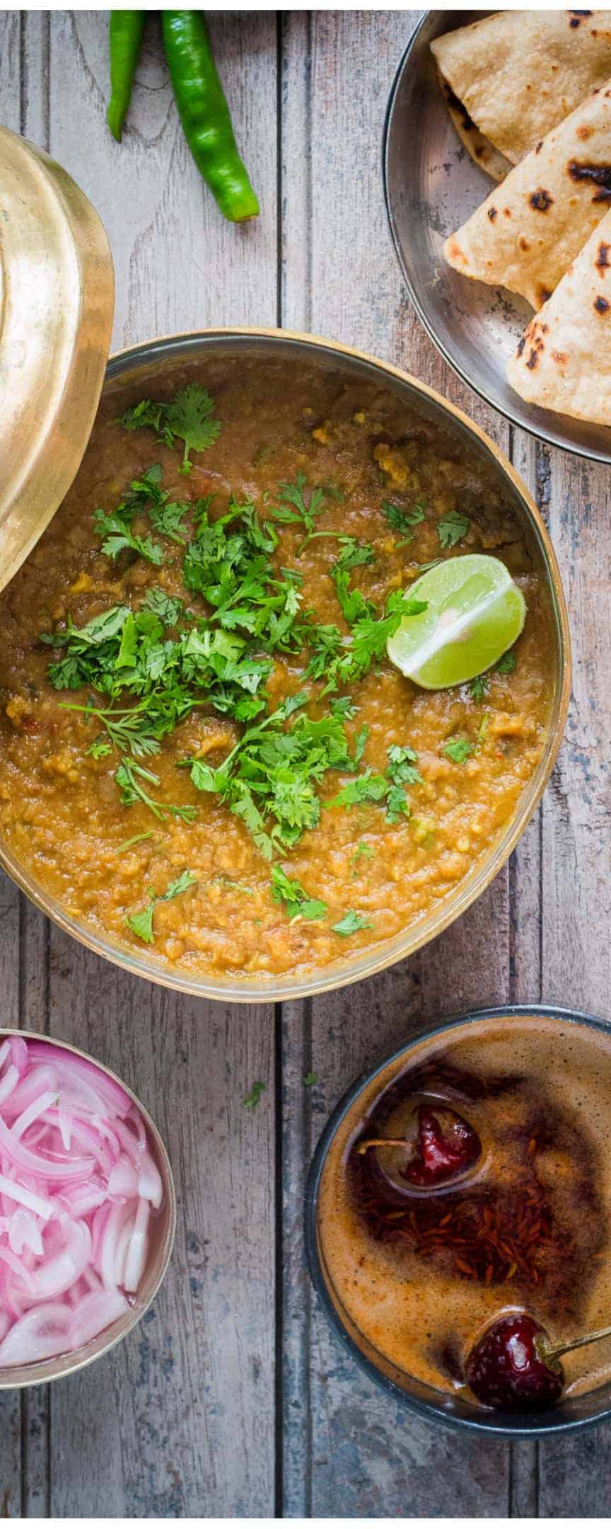 Dhaba style Dal fry served with roti and onions