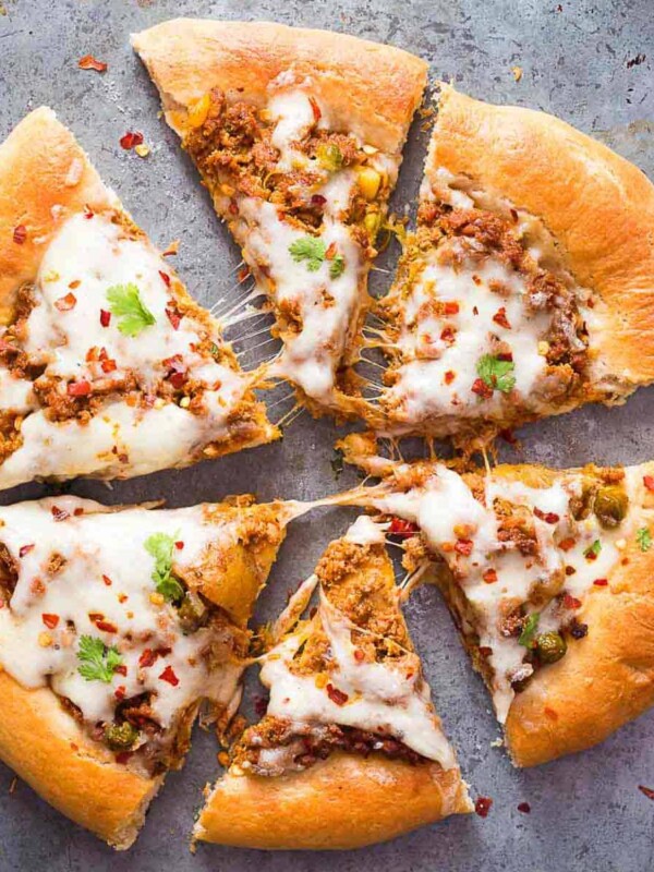 Wholewheat keema spice minced lamb pizza in a tray