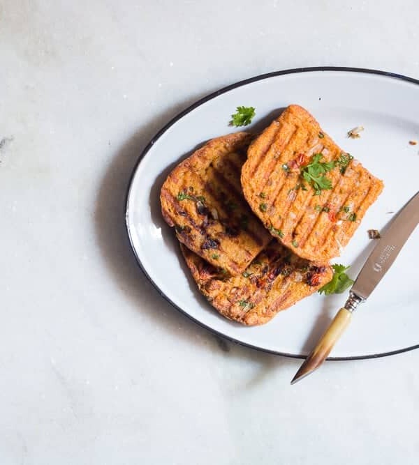 Masala french toast served from a large white plate.