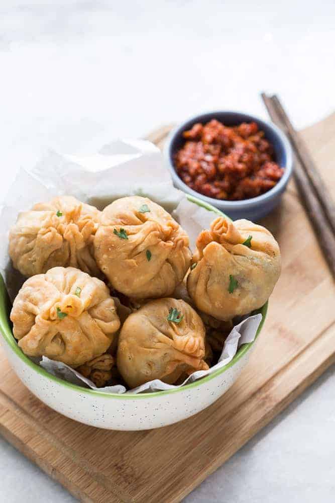 Love samosas? These vegetarian chinese potli samosa wontons are going to blow you over! I used a lo mein noodle filling but you can just as easily use shrimp, cream cheese, even chocolate to make these wontons at home. Also includes recipe for homemade samosa wrappers!