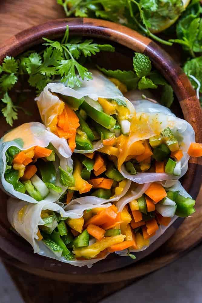 Mango Bell Pepper Rice Paper Rolls + Mango Cilantro Dipping Sauce These mango bell pepper rice paper rolls are the perfect summer food! They are stuffed with lots of amazing veggies and come with an insanely delicious mango cilantro dipping sauce! These are naturally gluten free, vegan and low carb!