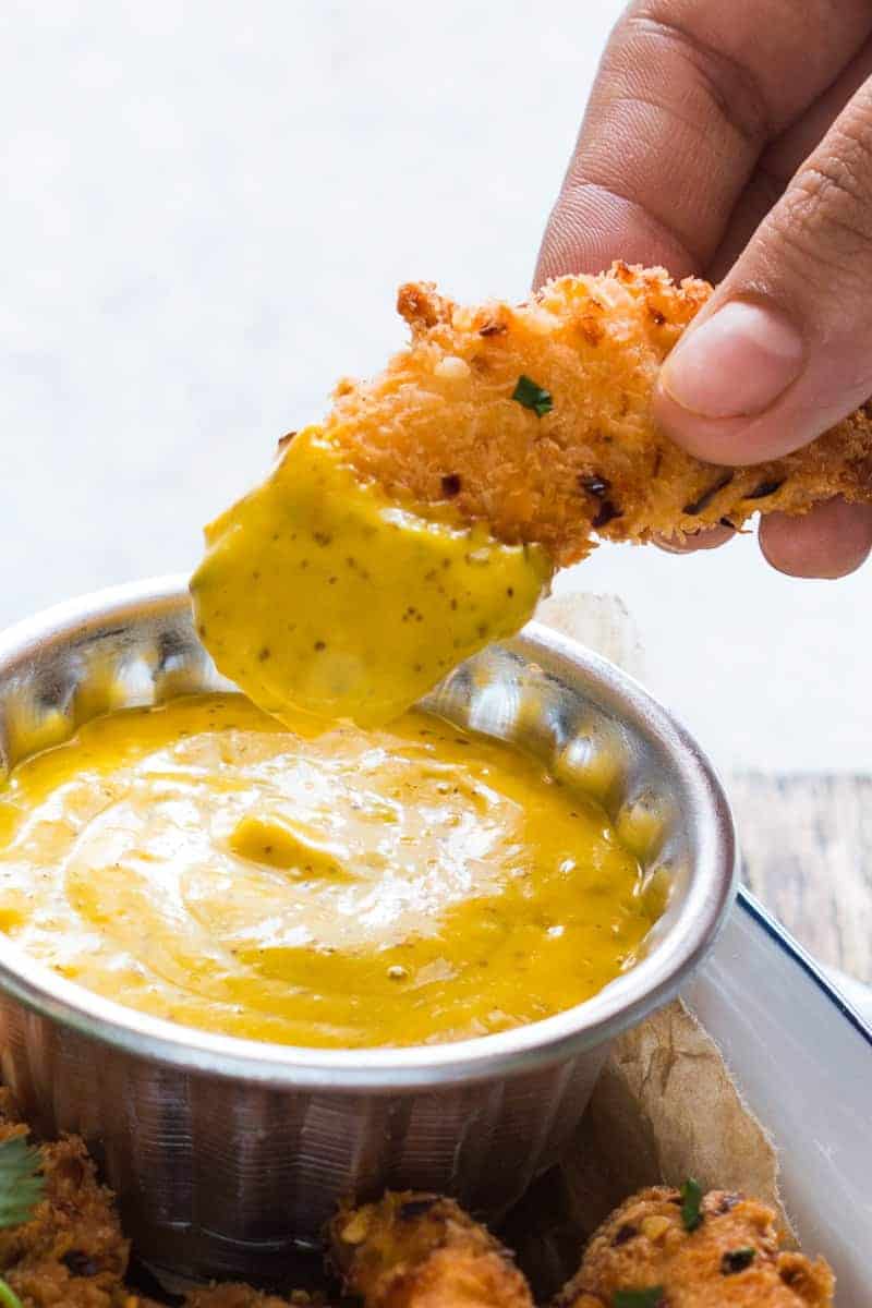 Baked Coconut Chicken Tenders with Mango Mustard Sauce Easy recipe for super crunchy baked coconut crusted chicken tenders which are going to be a favourite at every party with kids and adults alike! Gluten free too.
