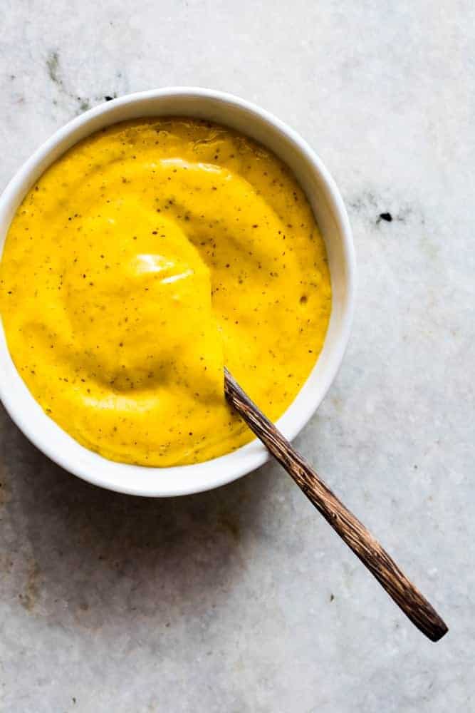 This easy tropical mango mustard dipping sauce is ready in 5 minutes and gets made in the blender. Goes really well with chicken tenders, wings, crackers, fries and chips!