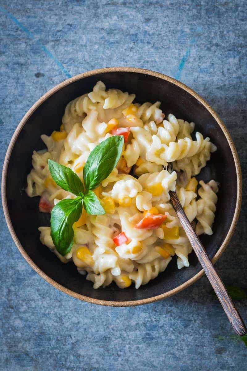 Lighter Creamier Corn Pepper Fusilli Alfredo A lighter, creamier corn pepper fusilli alfredo so that you can have your fill without the guilt! There are some real substitutions with whole wheat flour, skim milk and half the cheese making the sauce.