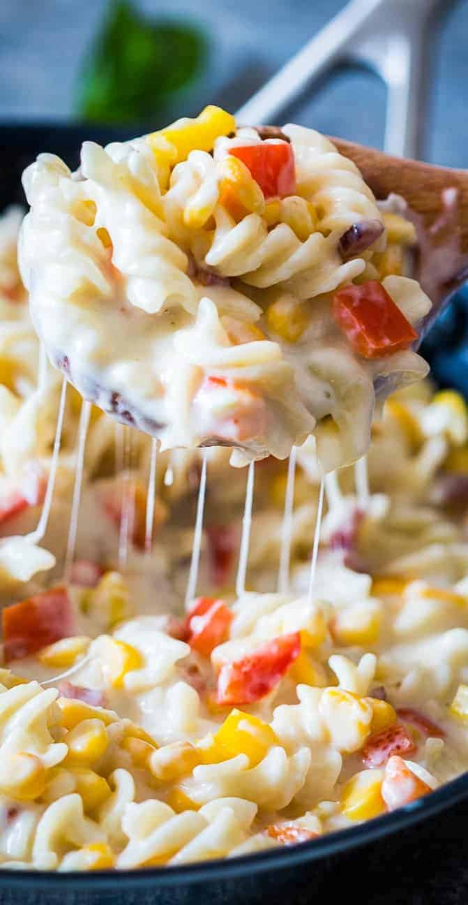 A lighter, creamier corn pepper fusilli alfredo so that you can have your fill without the guilt! There are some real substitutions with whole wheat flour, skim milk and half the cheese making the sauce.