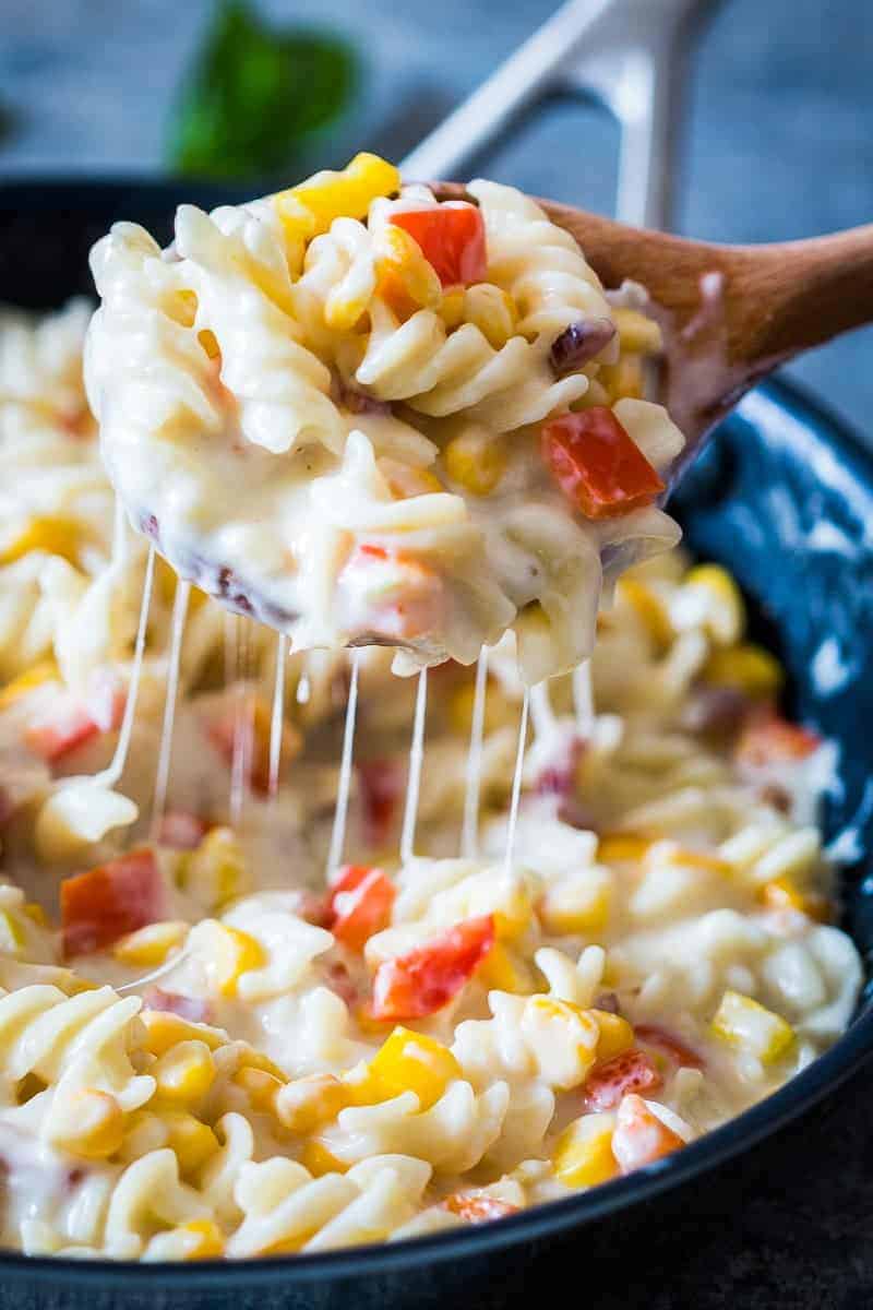 Lighter Creamier Corn Pepper Fusilli Alfredo A lighter, creamier corn pepper fusilli alfredo so that you can have your fill without the guilt! There are some real substitutions with whole wheat flour, skim milk and half the cheese making the sauce.