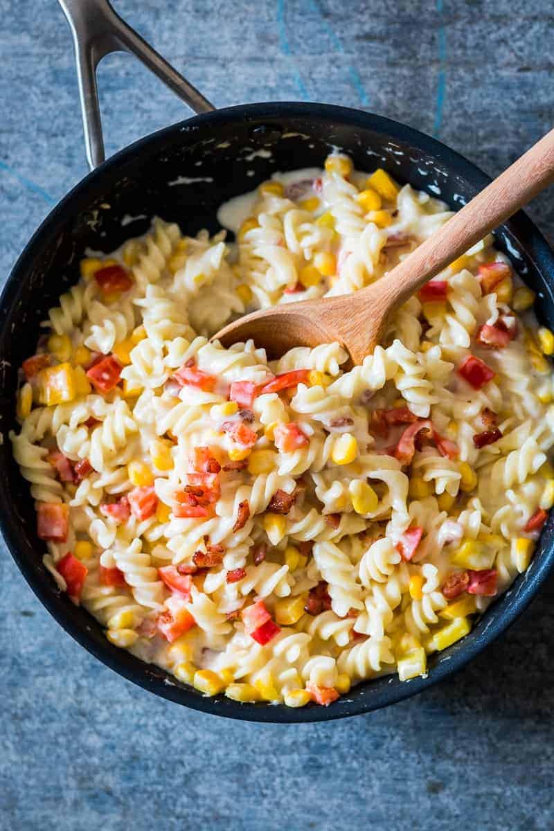 Lighter Creamier Corn Pepper Fusilli Alfredo A lighter, creamier corn pepper fusilli alfredo so that you can have your fill without the guilt! There are some real substitutions with whole wheat flour, skim milk and half the cheese making the sauce.