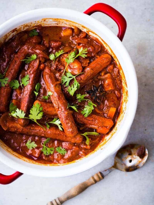 One Pot Curried Sausages and Potatoes garnished with coriander.