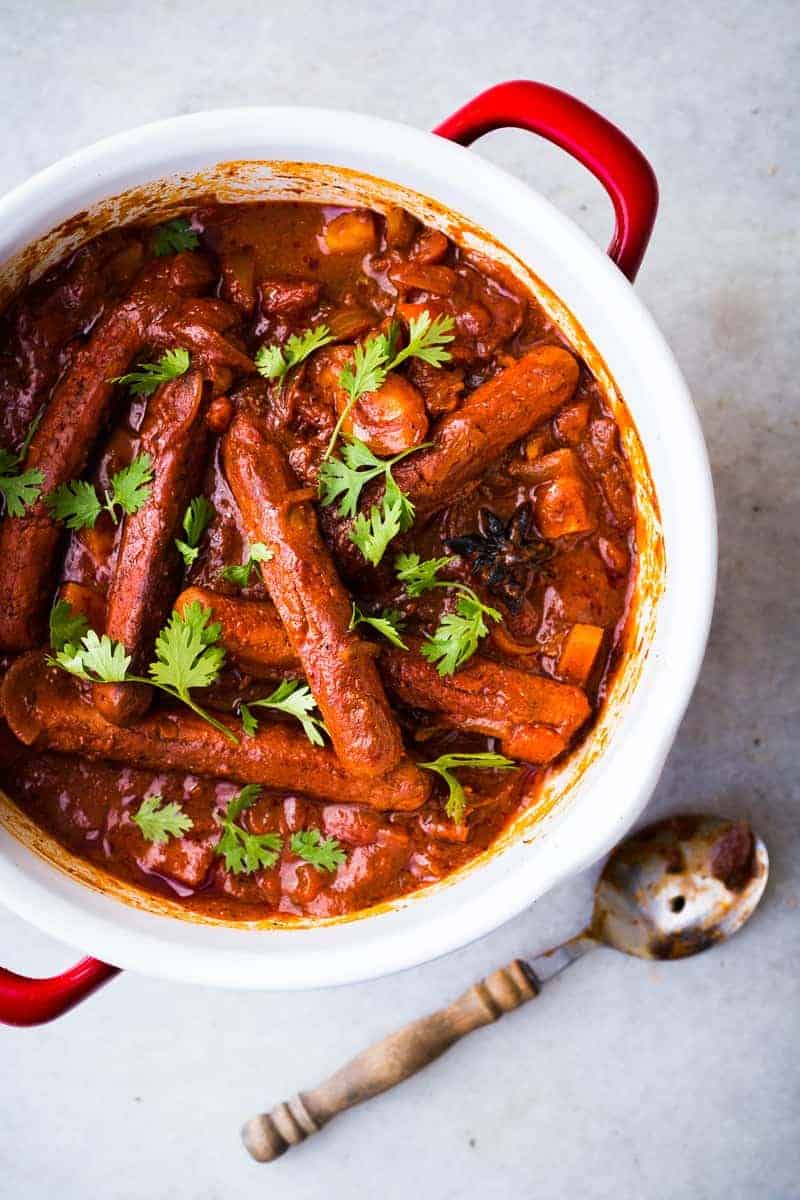 Insanely delicious and super easy recipe for curried sausages and potatoes which needs only one pot and is ready in under 30 minutes! 