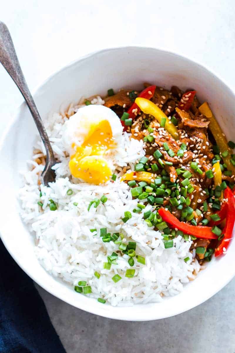Easy Slow Cooker Korean Pork Bulgogi recipe that can be made in a crockpot and has spicy gochujang in it's marinade. Healthy, yummy stew that's perfect over rice for dinner!
