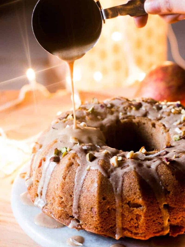 Garam Masala Eggless Apple Bundt Cake topped with a brown butter and rum glaze.