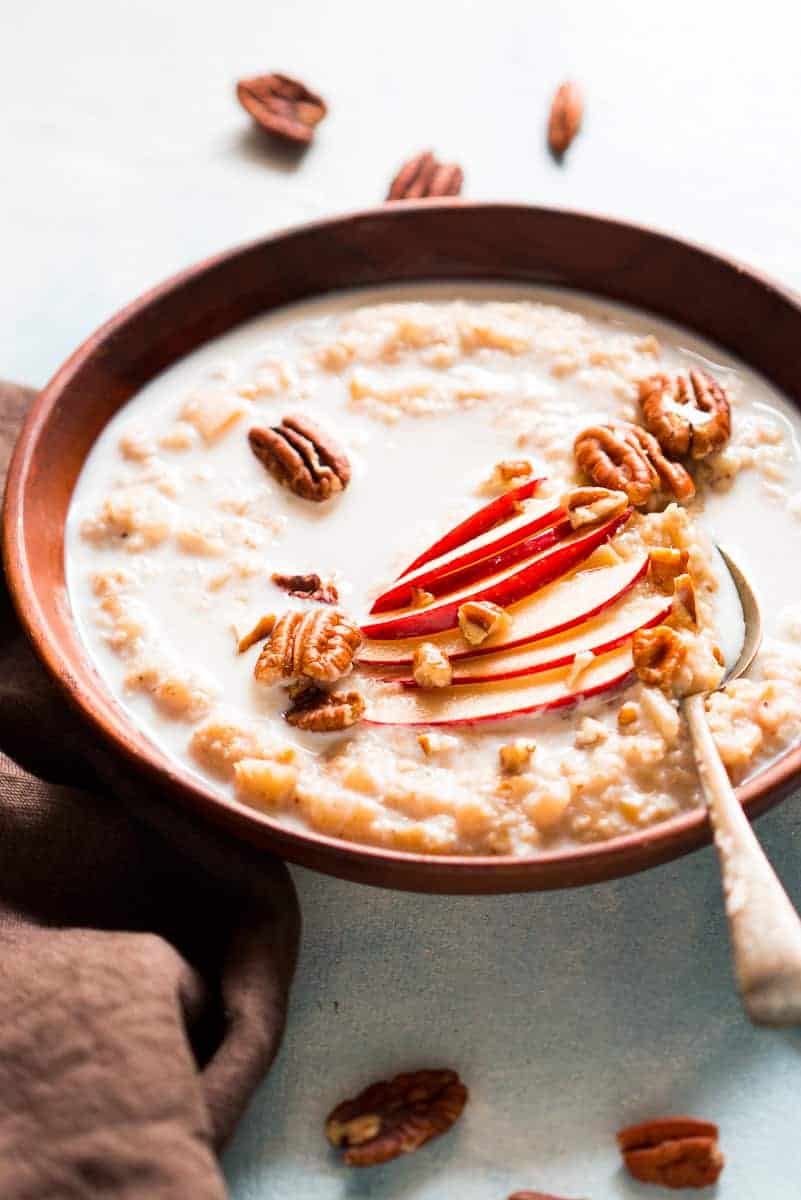 Quick and Healthy Apple Pie Oatmeal Breakfast Bowls - topped with pecan, honey and cinnamon. Stovetop recipe made with Quaker Oats.