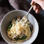 Creamy Lemon Mushroom Kale Linguine Pasta served in a grey bowl.