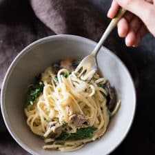 Creamy Lemon Mushroom Kale Linguine Pasta served in a grey bowl.