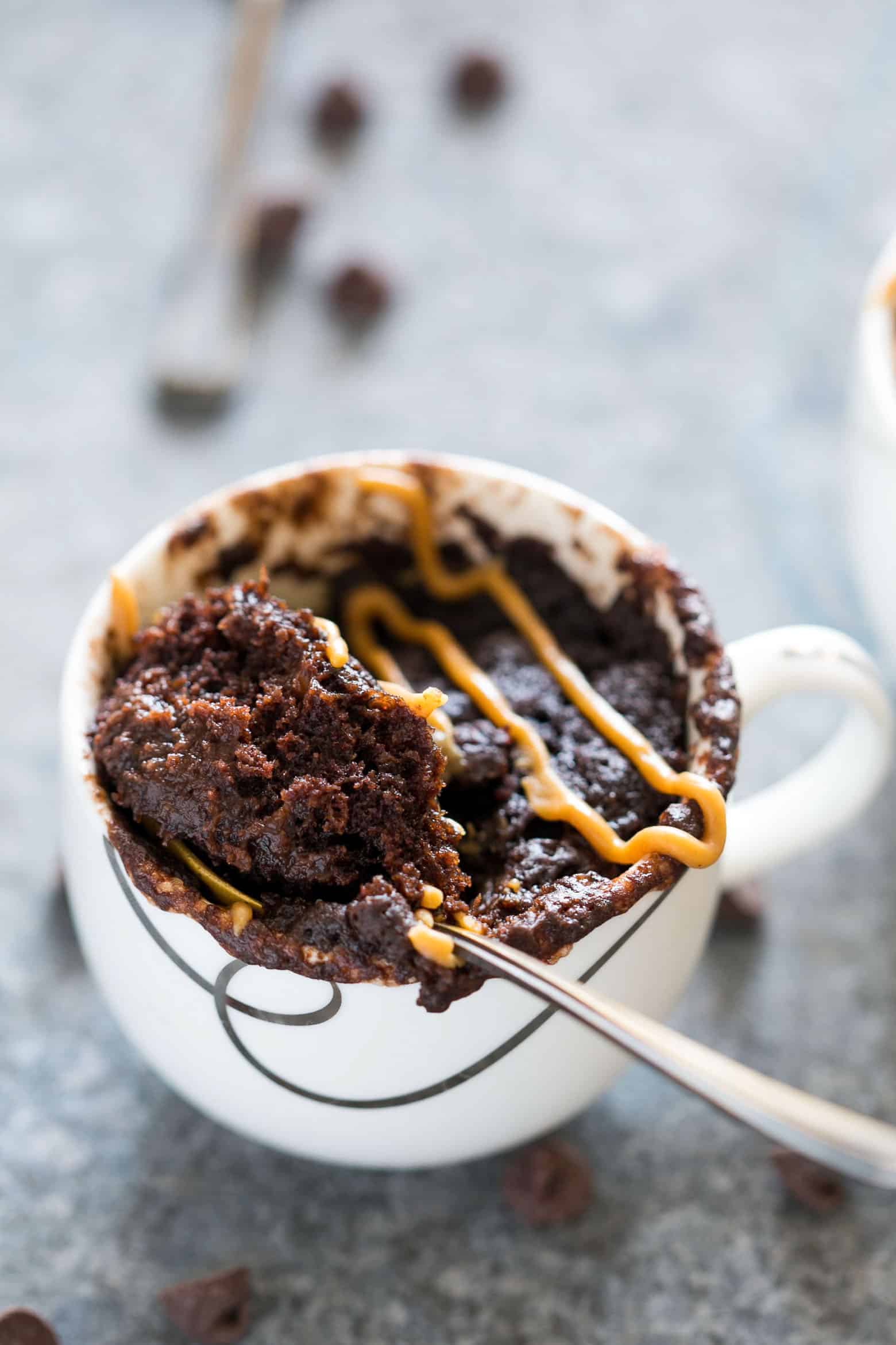 Single serving eggless banana chocolate peanut butter mug cake is the best, gooey and the moistest mug cake recipe you'll try. Ready in under 5 minutes and just needs a microwave!