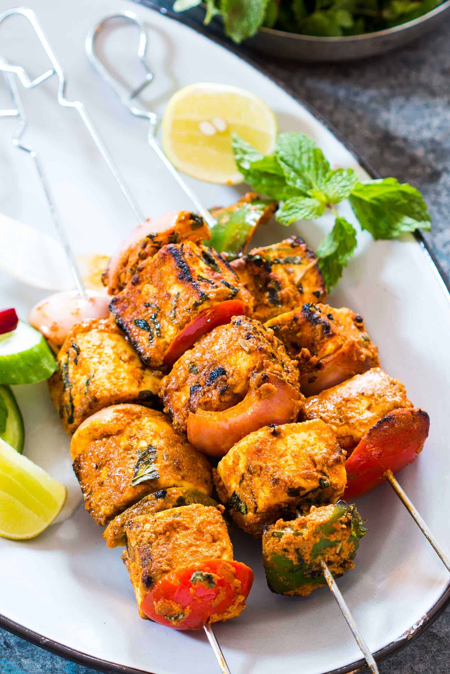 This is the best Tandoori Paneer Tikka in the oven you'll ever make at home! Same restaurant style taste, but roasted in the oven. 
