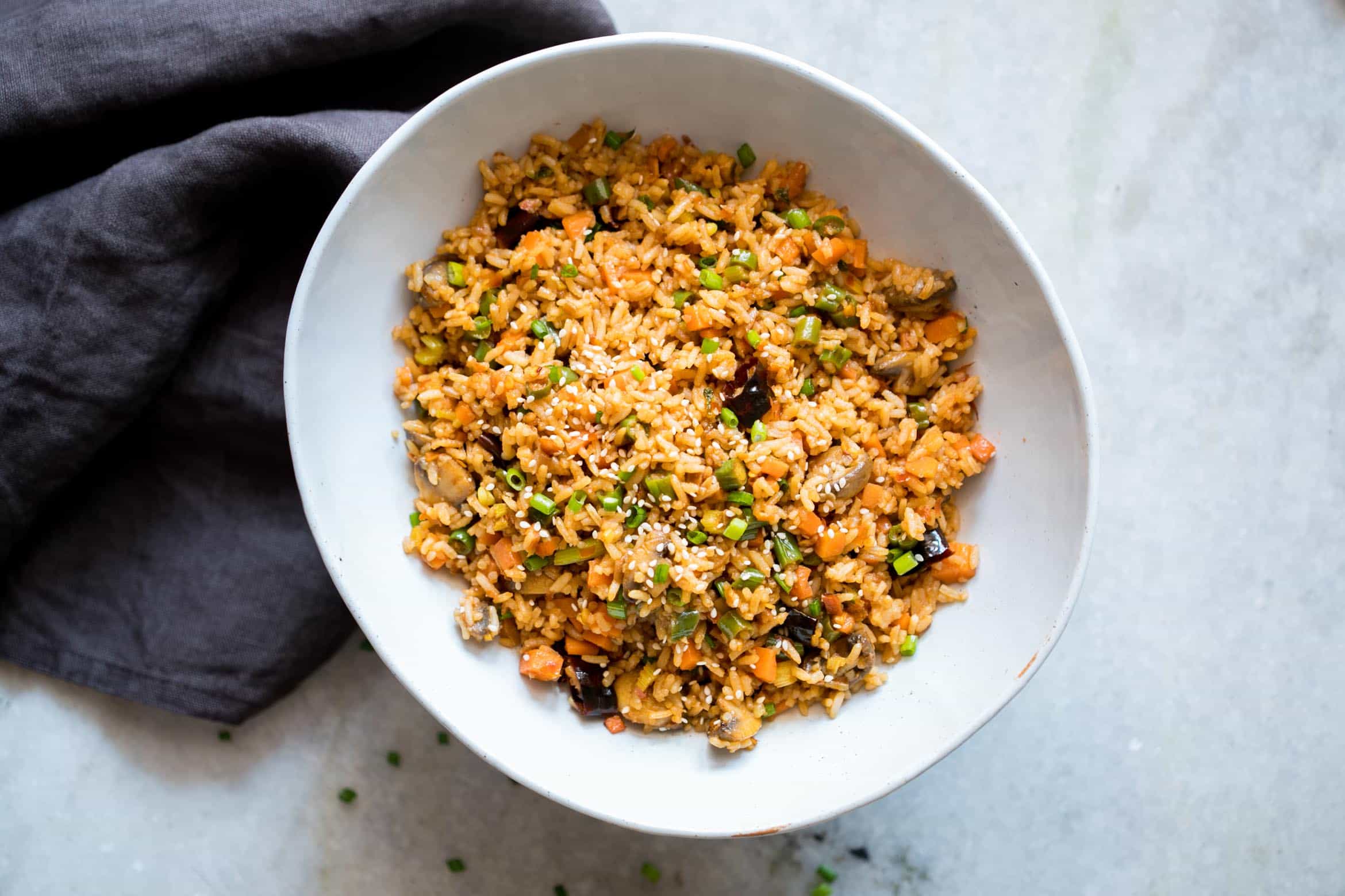 This is the best chinese schezwan fried rice you'll make - loaded with vegetables, spicy and super easy! Made with sichuan sauce, it's the best way to use leftover rice.