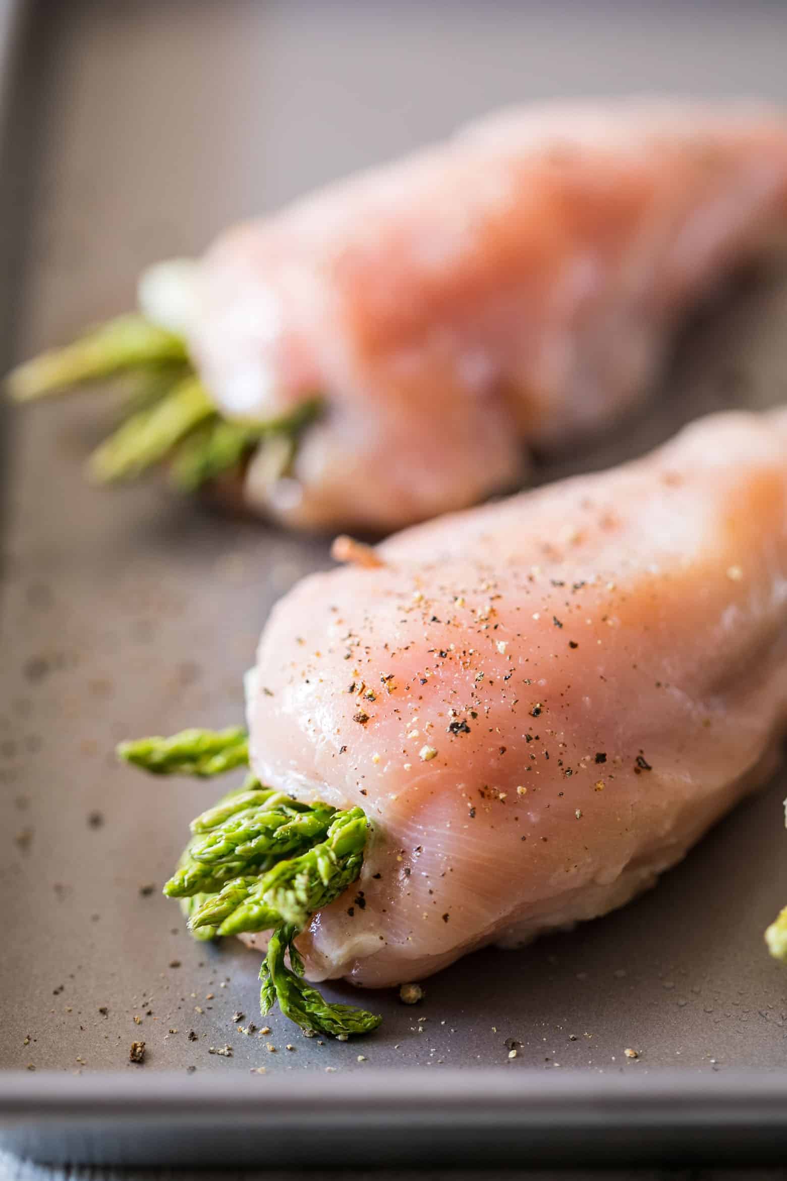 Asparagus Stuffed Chicken Parmesan is a easy, healthy dinner recipe that combines two of our favourites. Topped with marinara sauce and stuffed with cream cheese and asparagus, it's keto friendly, low carb, gluten free and ready in 30 minutes.