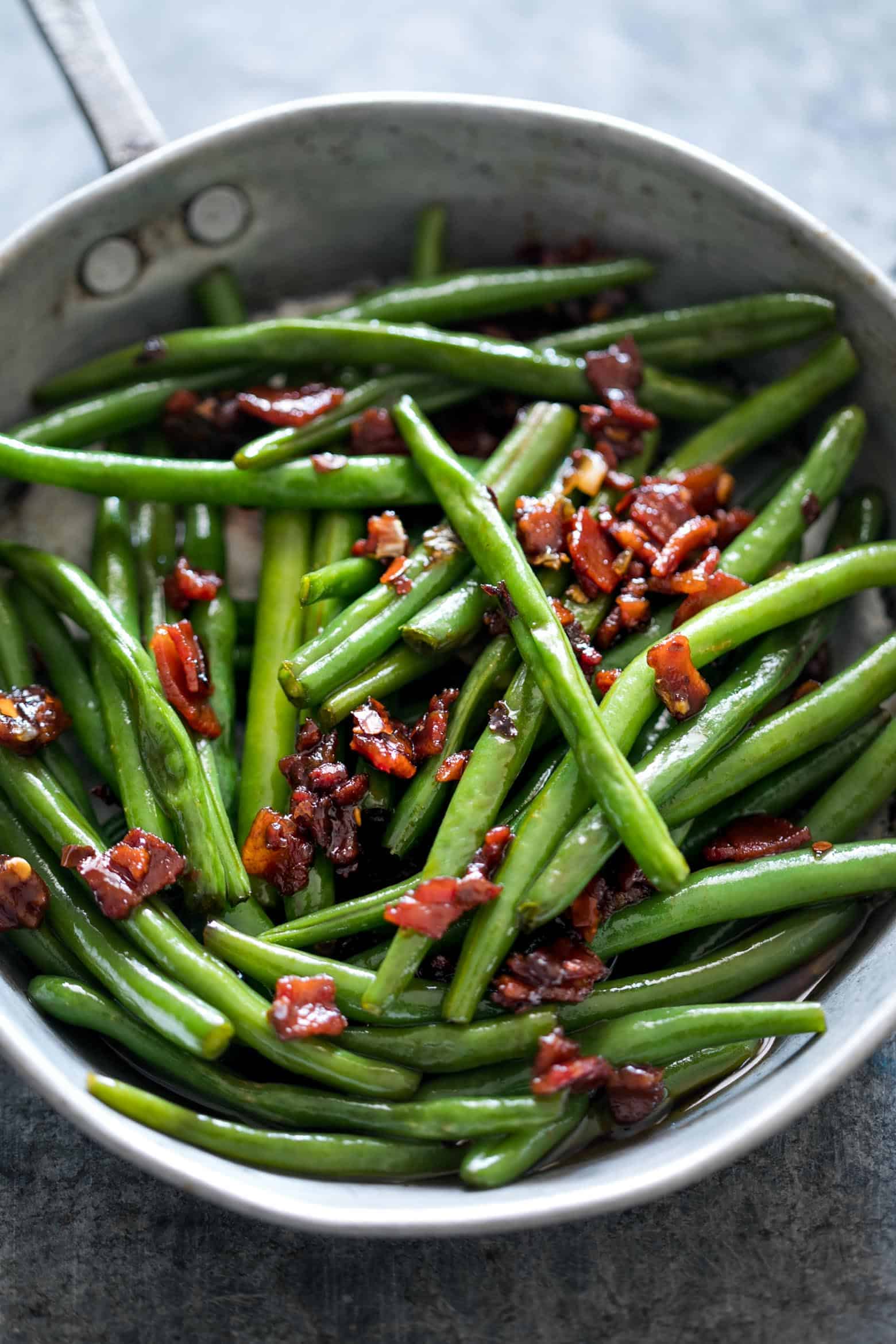 Sauteed Brown Sugar Bacon Garlic Green Beans is an insanely delicious side dish - sweet, garlicky with bits of candied bacon. Everyone will ask for seconds!