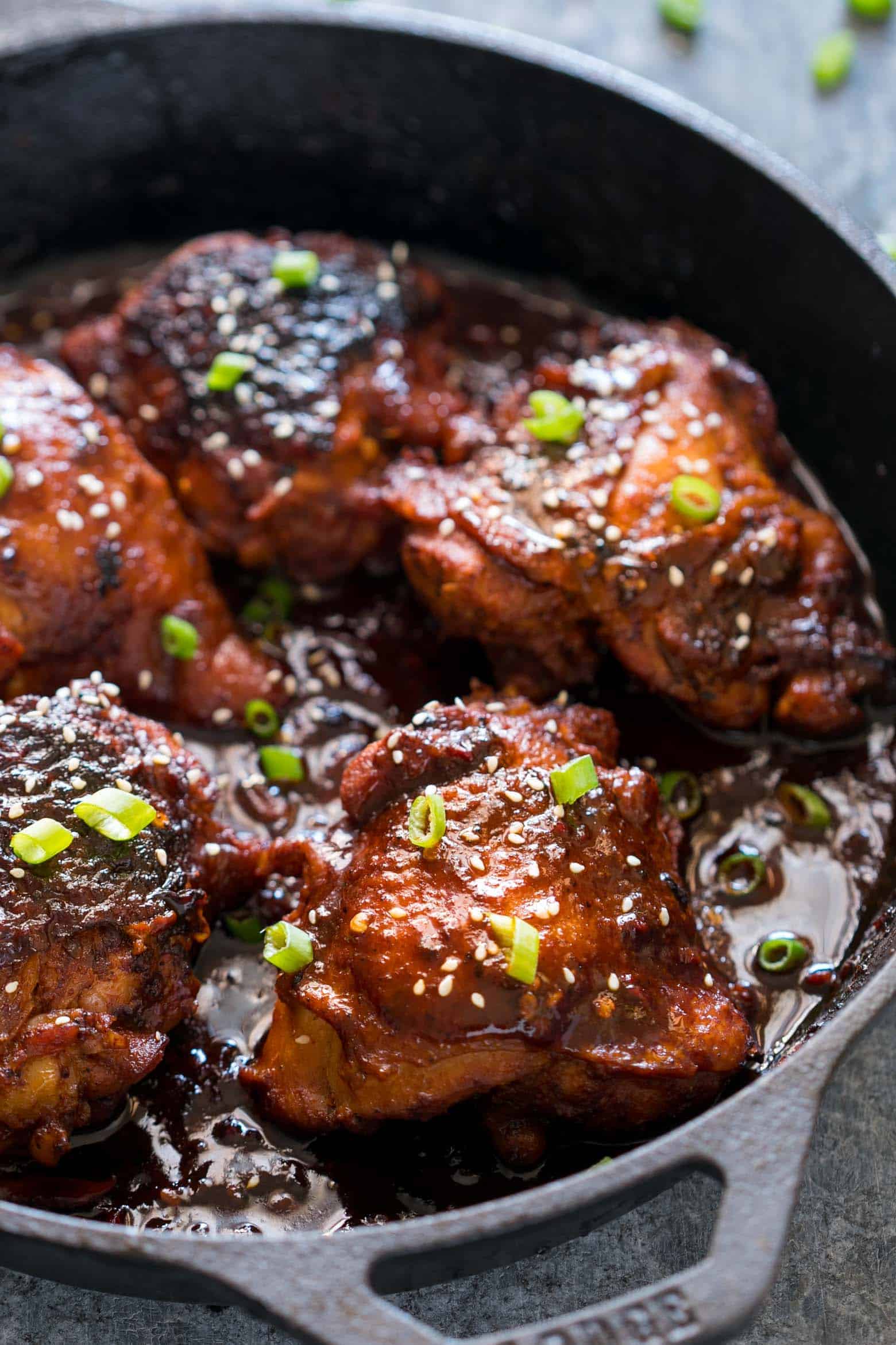 Spicy Korean Chicken Thighs in Gochujang Sauce - an intensely flavoured chicken recipe made in a cast iron pan for extra crispy, juicy thighs and a finger licking marinade!