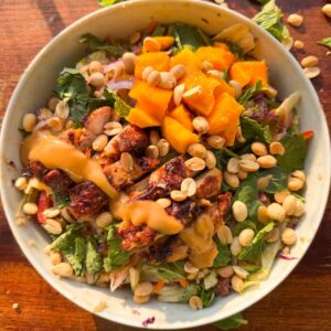 an image of thai mango quinoa salad served in a bowl