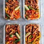 Chicken fajita with cilantro lime quinoa and grilled veggies in glass containers.
