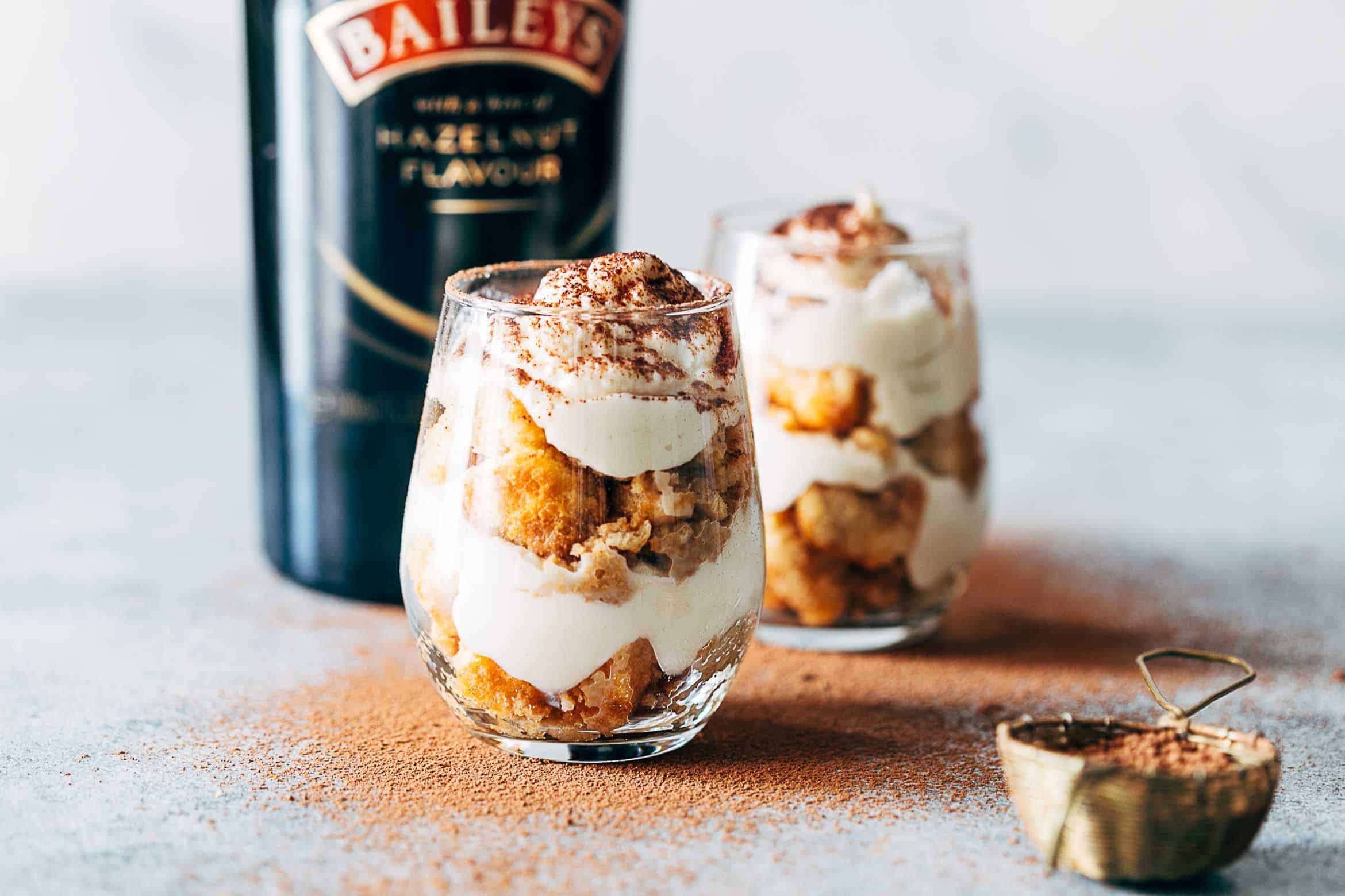 Easy Baileys Tiramisu Trifle Cups are a fun take on the classic Italian Tiramisu recipe. Made eggless, this make-ahead eight ingredient dessert is the perfect summer recipe.