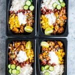 Chicken Burrito meal made ahead for the week and stored in a black refrigerator and microwave friendly box!