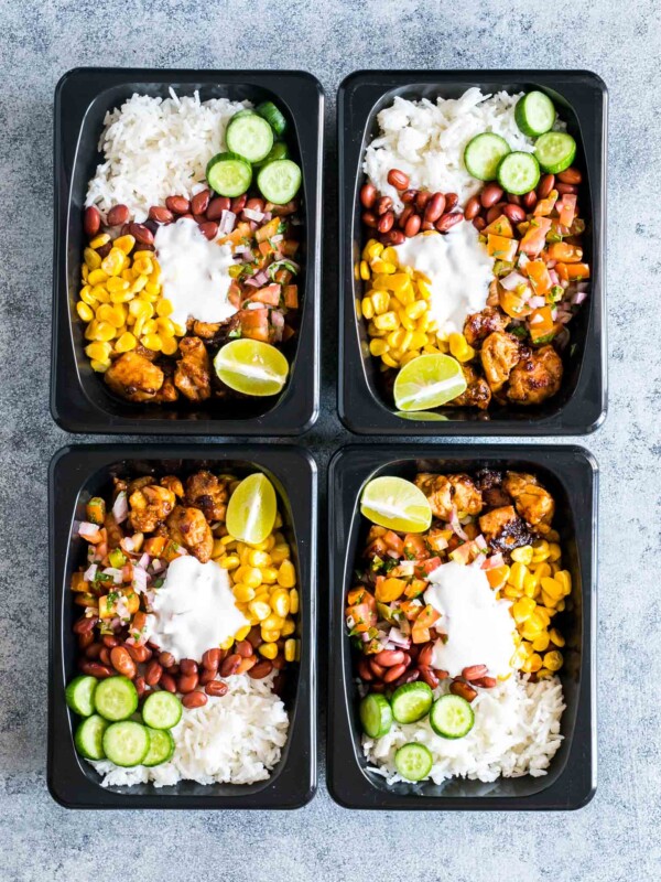 Chicken Burrito meal made ahead for the week and stored in a black refrigerator and microwave friendly box!