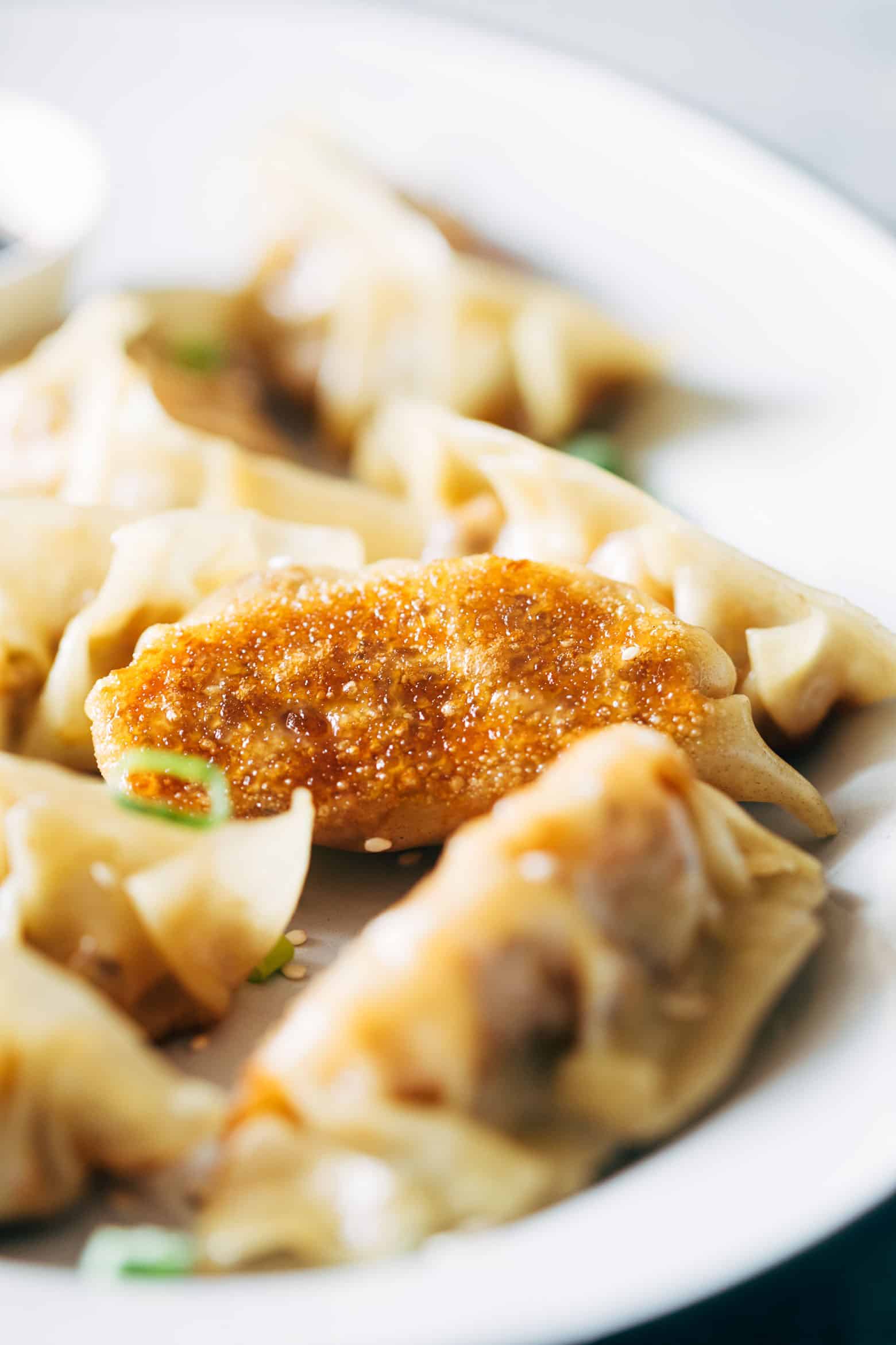 These vegetarian gyoza potstickers are stuffed with a delicious mixture of carrot, shiitake mushrooms and paneer and are insanely ease to make! Don't be intimidated because I have step by step instructions for you to make them at home.
