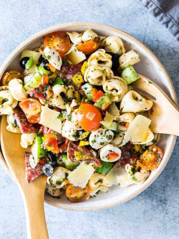 Italian Antipasto Tortellini Pasta Salad put together in a white bowl.