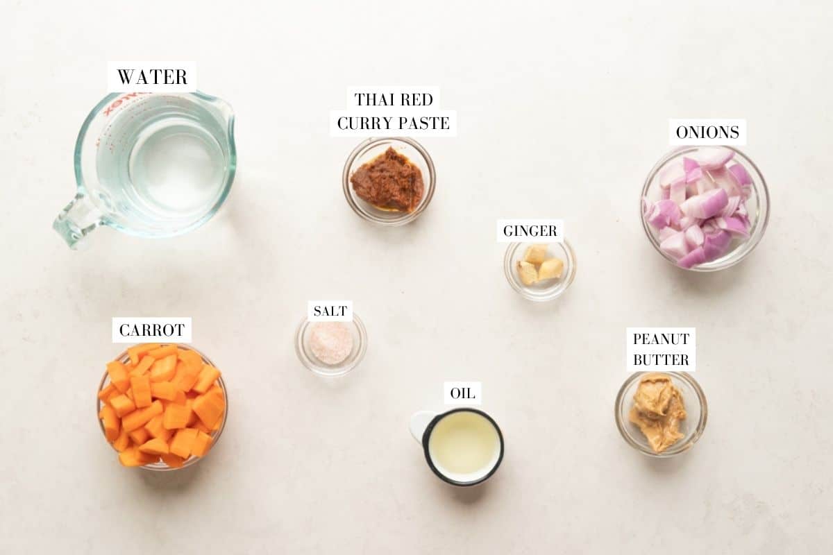 Picture of all the ingredients for Thai Ginger Carrot Soup with text to identify them