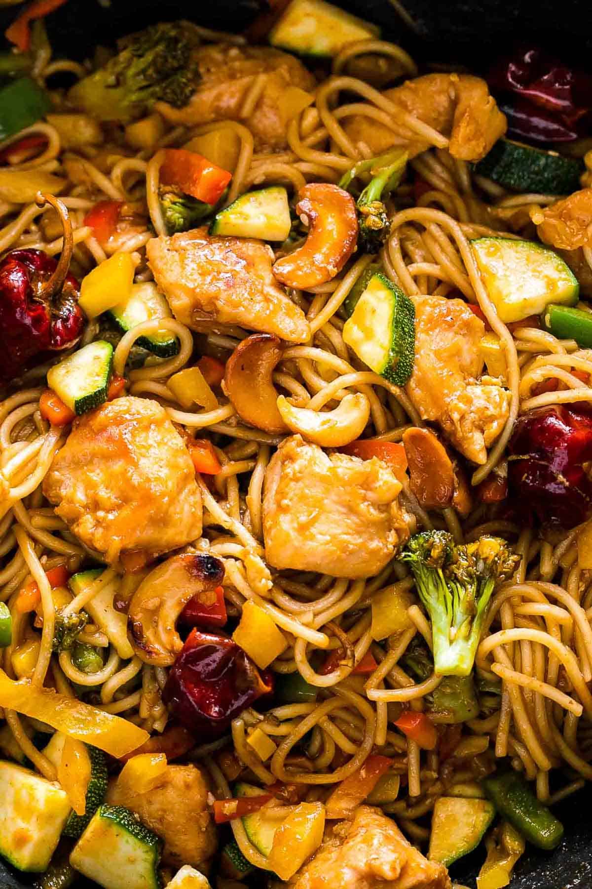 Chinese Cashew Chicken Noodles Stir-Fry in a pan.