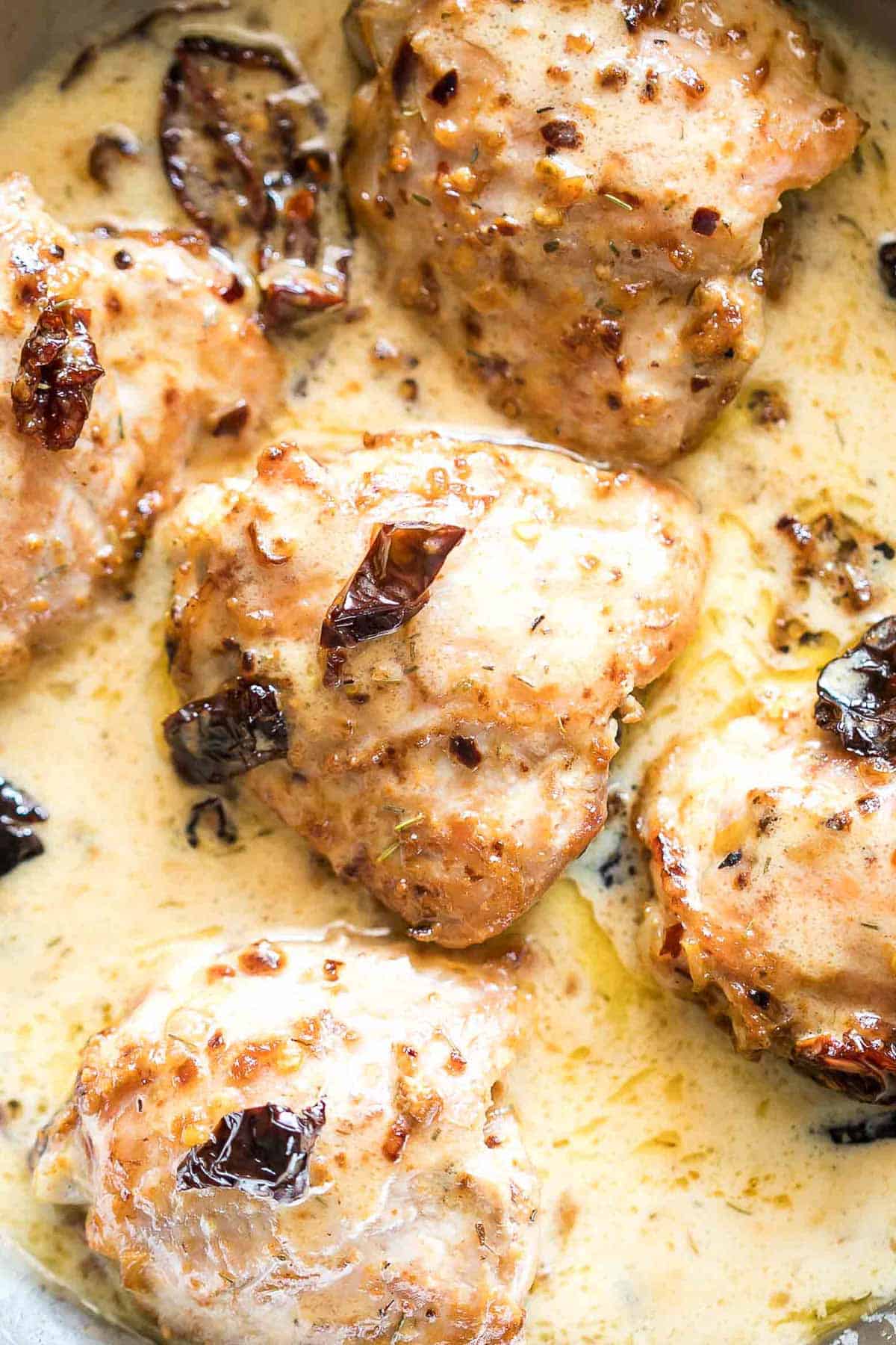 Creamy Sun-dried Tomato Chicken in a pan.