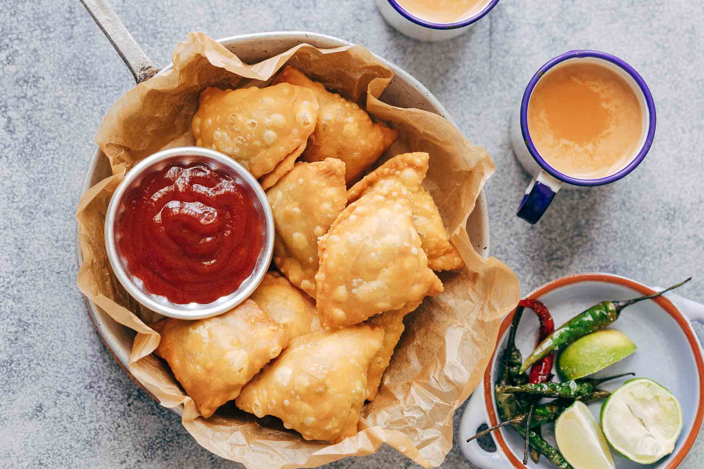 This is definitely the best Indian punjabi samosa you'll every make at home! I'm arming you with step by step directions and a recipe video for you to follow. So you can learn how to make the samosa dough, the aloo stuffing and how to easily wrap them.ย
