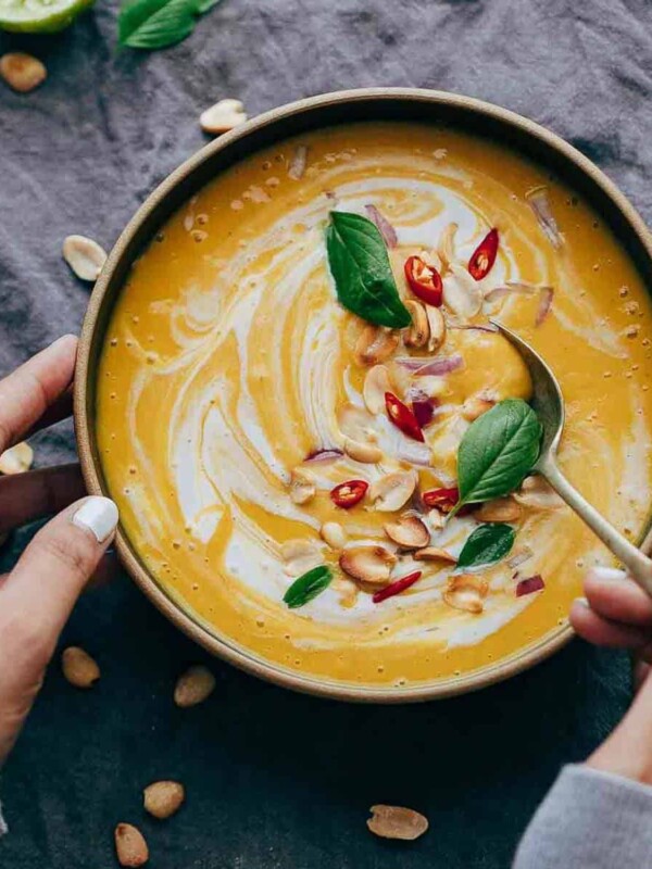 This Thai Butternut Squash Sweet Potato Bisque is perfect for cold winter days - super thick and creamy soup with a hint of heat that will keep you warm and cozy. It has all the fall flavours and ingredients - onions, carrots, butternut squash, sweet potato, thai curry paste and coconut milk.