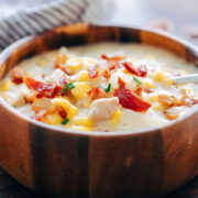 Instant Pot Chicken Potato Corn Chowder with Bacon served in a wooden bowl.