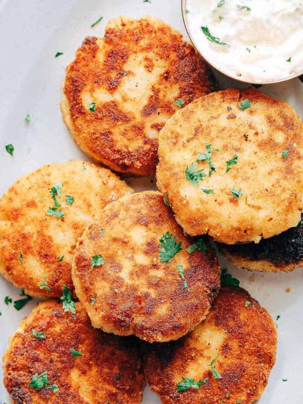 Picture of Leftover Mashed Potato Ham Cakes on a plate with sour cream