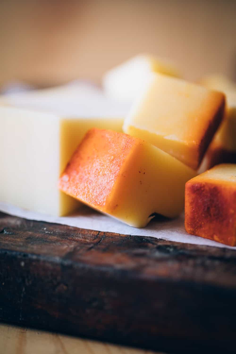 Picture of gruyere, emmental, cheddar cut up into chunks for Easy cheese fondue recipe with white wine