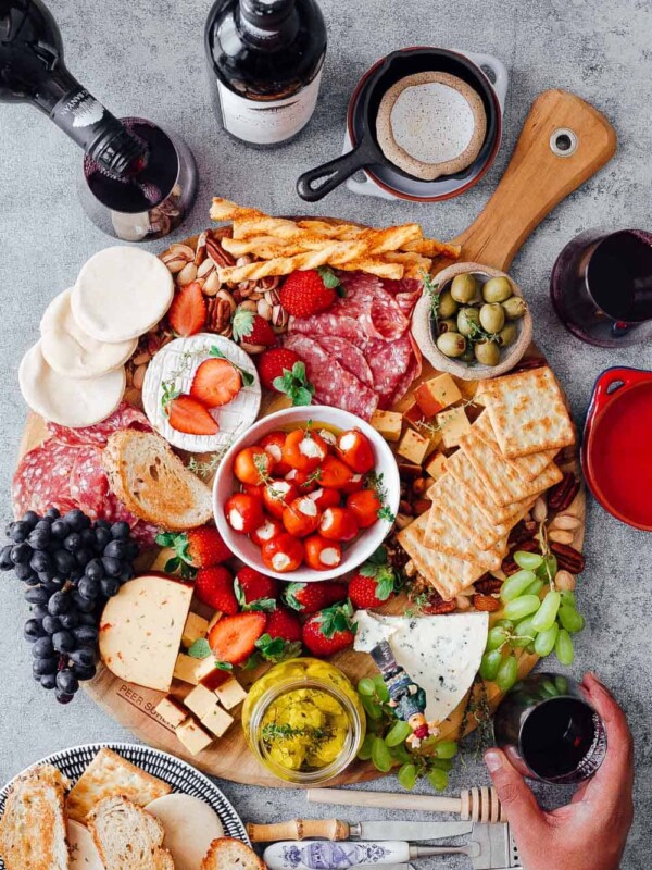Learn how to make the Ultimate Wine and Cheese Board on a budget with simple tips and tricks. You'll be a DIY cheeseboard ninja by the end of this detailed post. Perfect for Christmas holidays, as a party appetizer for a crowd or for a romantic dinner date.