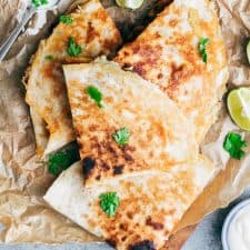 Chicken fajita quesadilla with crispy bits of cheese stuck to the fajitas