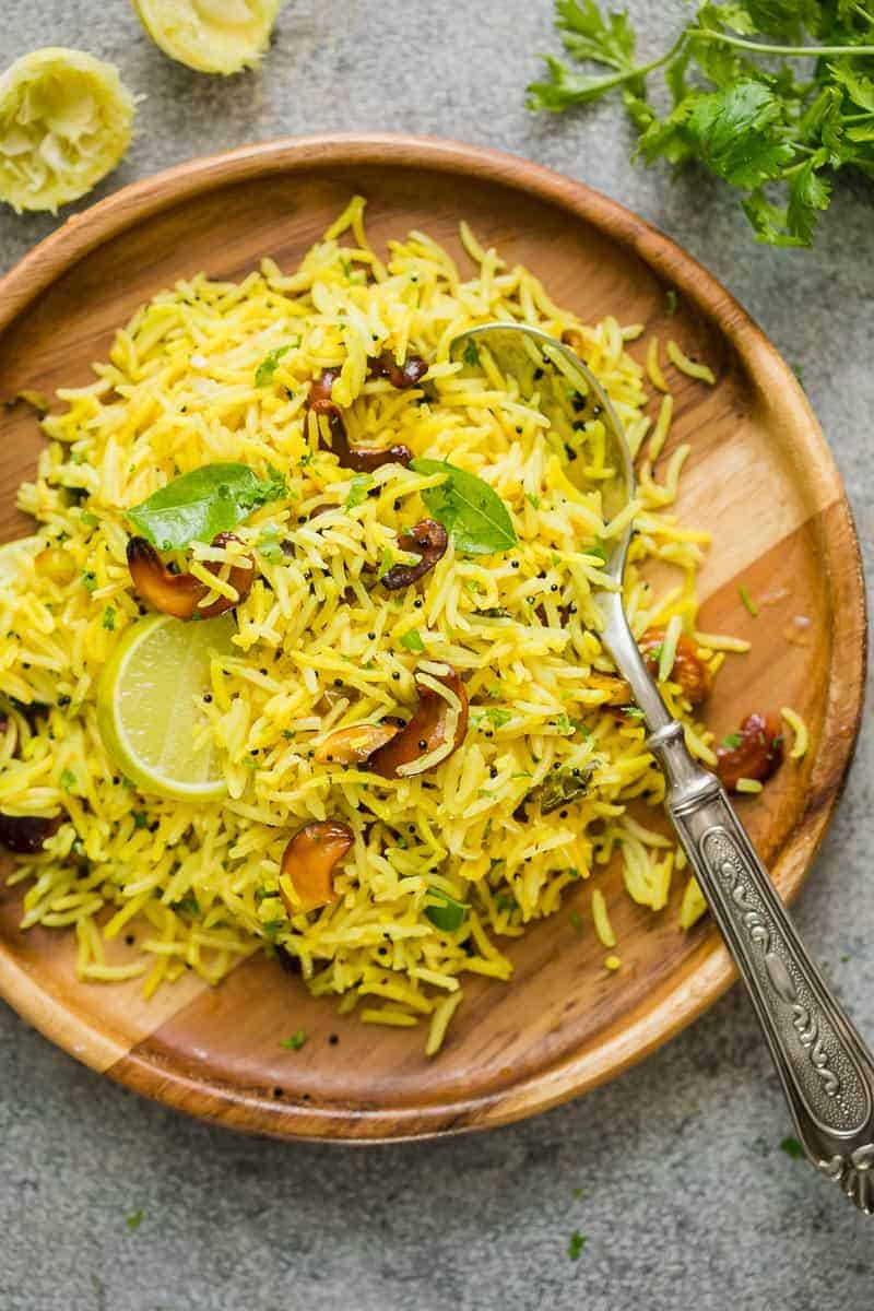 Easy lemon rice served on a brown plate with a spoon