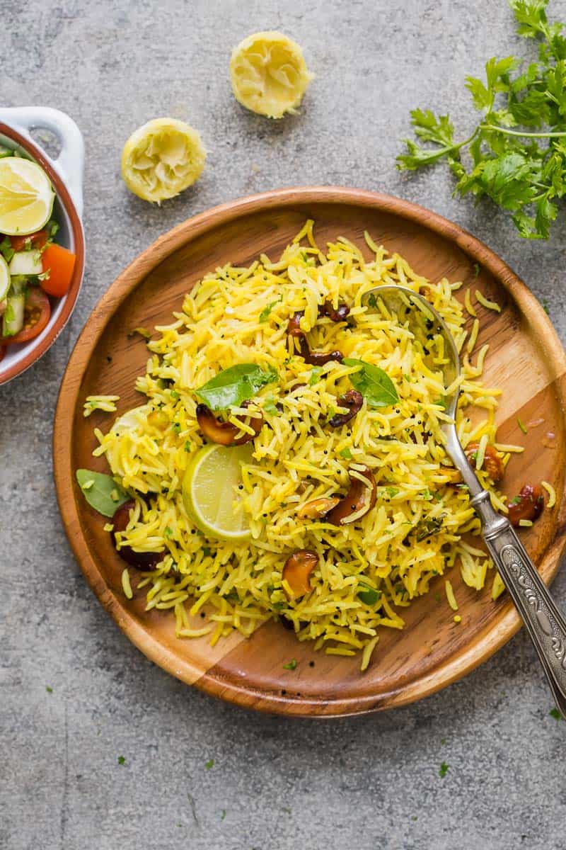 Easy lemon rice served on a brown plate with a spoon